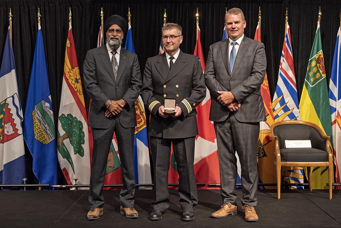 The Honourable Harjit S. Sajjan, President of the King's Privy Council for Canada and Minister of Emergency Preparedness (far left) and Minister responsible for the Pacific Economic Development Agency of Canada, and the Honourable Bloyce Thompson, Deputy Premier, Minister of Justice and Public Safety and Attorney General for Prince Edward Island (far right) are pictured with the 2022 award recipient of the Emergency Management Exemplary Service Award for the Search and Rescue category.
