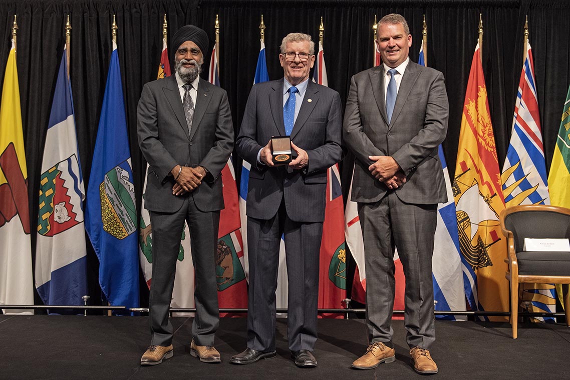 The Honourable Harjit S. Sajjan, President of the King's Privy Council for Canada and Minister of Emergency Preparedness (far left) and Minister responsible for the Pacific Economic Development Agency of Canada, and the Honourable Bloyce Thompson, Deputy Premier, Minister of Justice and Public Safety and Attorney General for Prince Edward Island (far right) are pictured with the 2022 award recipient of the Emergency Management Exemplary Service Award for the Search and Rescue category.