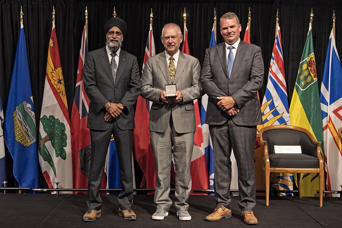 The Honourable Harjit S. Sajjan, President of the King's Privy Council for Canada and Minister of Emergency Preparedness (far left) and Minister responsible for the Pacific Economic Development Agency of Canada, and the Honourable Bloyce Thompson, Deputy Premier, Minister of Justice and Public Safety and Attorney General for Prince Edward Island (far right) are pictured with the 2022 award recipient of the Emergency Management Exemplary Service Award for the Search and Rescue category.