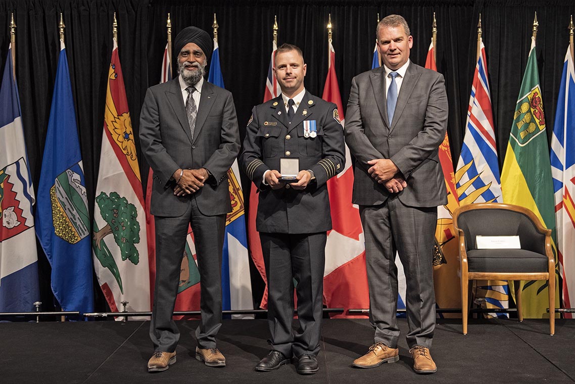 The Honourable Harjit S. Sajjan, President of the King's Privy Council for Canada and Minister of Emergency Preparedness (far left) and Minister responsible for the Pacific Economic Development Agency of Canada, and the Honourable Bloyce Thompson, Deputy Premier, Minister of Justice and Public Safety and Attorney General for Prince Edward Island (far right) are pictured with the 2022 award recipient of the Emergency Management Exemplary Service Award for the Outstanding Contribution to Emergency Management category.