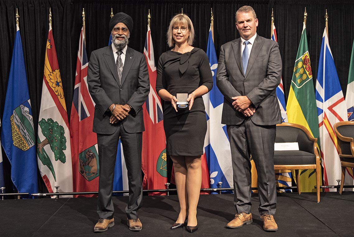 The Honourable Harjit S. Sajjan, President of the King's Privy Council for Canada and Minister of Emergency Preparedness (far left) and Minister responsible for the Pacific Economic Development Agency of Canada, and the Honourable Bloyce Thompson, Deputy Premier, Minister of Justice and Public Safety and Attorney General for Prince Edward Island (far right) are pictured with the 2022 award recipient of the Emergency Management Exemplary Service Award for the Outstanding Contribution to Emergency Management category.