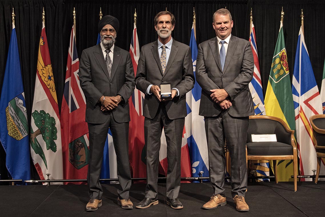 The Honourable Harjit S. Sajjan, President of the King's Privy Council for Canada and Minister of Emergency Preparedness (far left) and Minister responsible for the Pacific Economic Development Agency of Canada, and the Honourable Bloyce Thompson, Deputy Premier, Minister of Justice and Public Safety and Attorney General for Prince Edward Island (far right) are pictured with the 2022 award recipient of the Emergency Management Exemplary Service Award for the Outstanding Contribution to Emergency Management category.