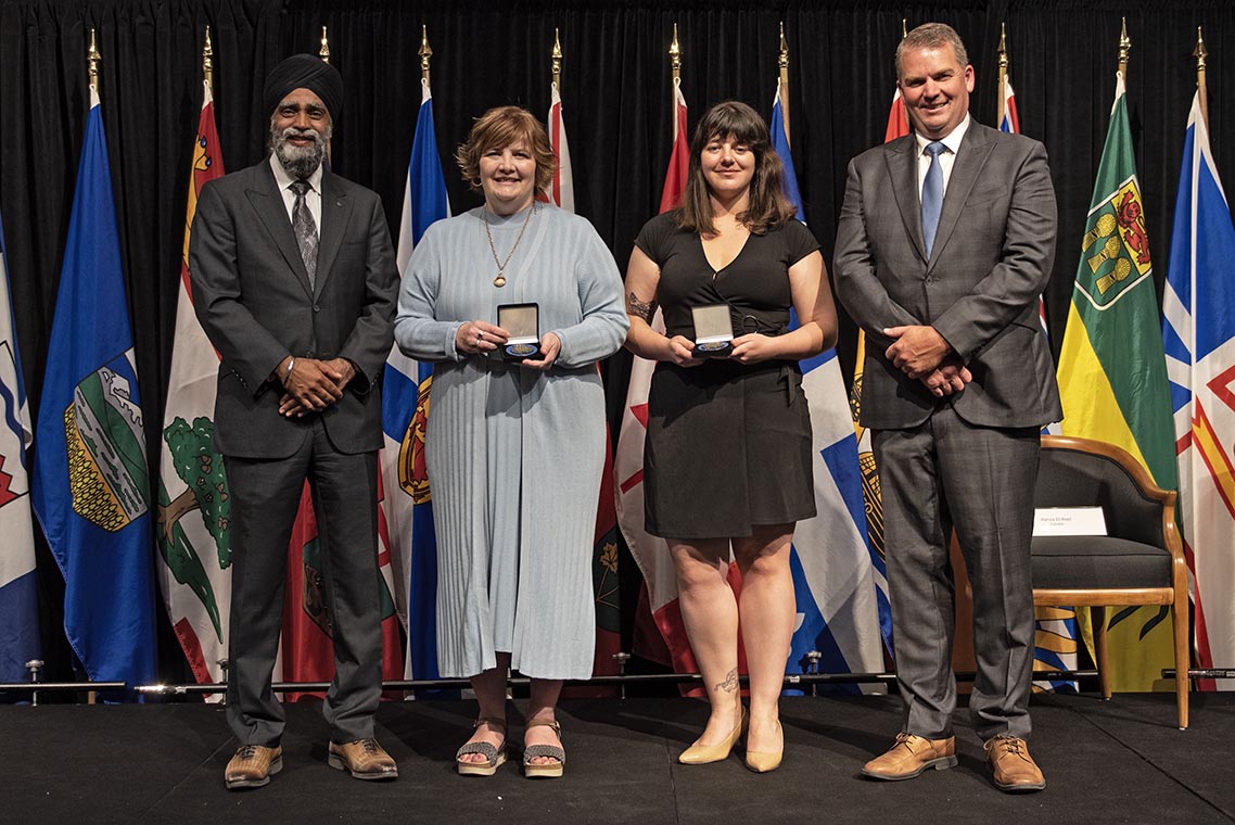 The Honourable Harjit S. Sajjan, President of the King's Privy Council for Canada and Minister of Emergency Preparedness (far left) and Minister responsible for the Pacific Economic Development Agency of Canada, and the Honourable Bloyce Thompson, Deputy Premier, Minister of Justice and Public Safety and Attorney General for Prince Edward Island (far right) are pictured with the 2022 award recipients of the Emergency Management Exemplary Service Award for the Outstanding Contribution to Emergency Management category.