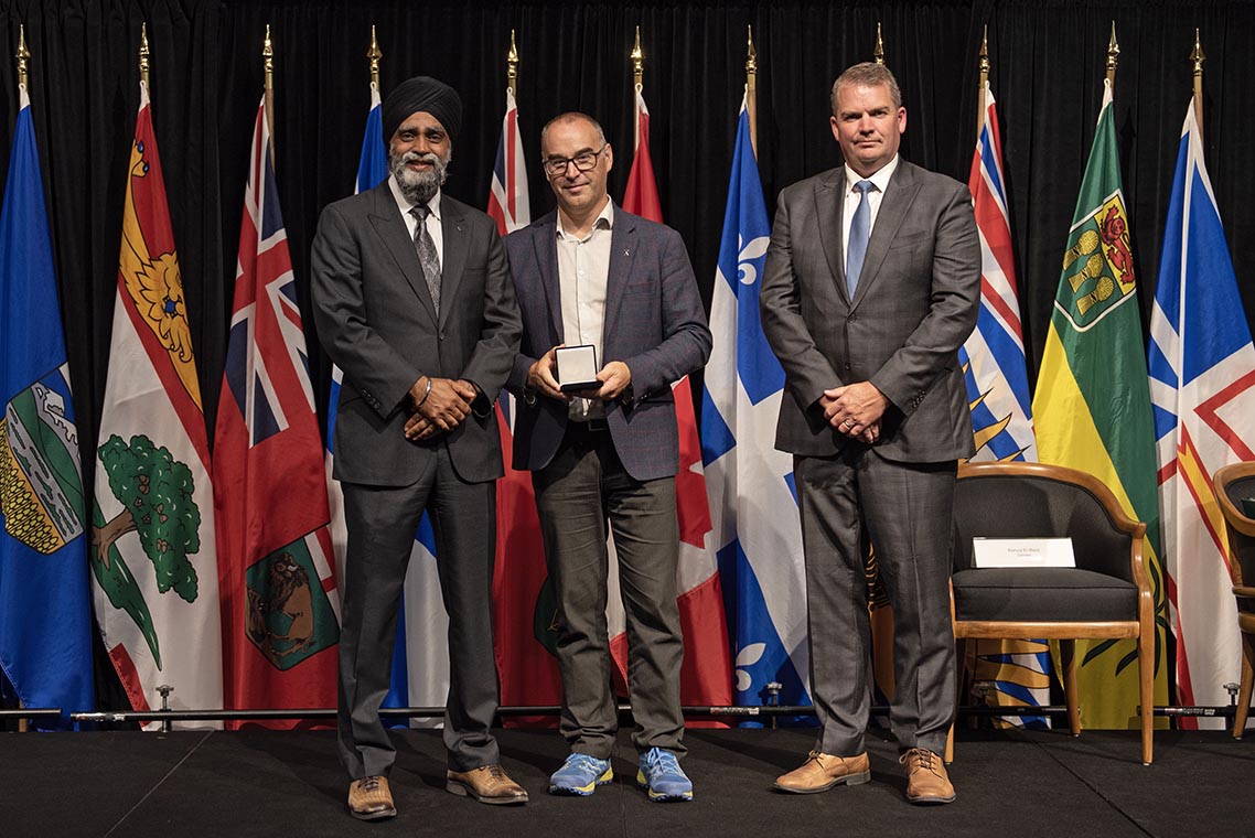 The Honourable Harjit S. Sajjan, President of the King's Privy Council for Canada and Minister of Emergency Preparedness (far left) and Minister responsible for the Pacific Economic Development Agency of Canada, and the Honourable Bloyce Thompson, Deputy Premier, Minister of Justice and Public Safety and Attorney General for Prince Edward Island (far right) are pictured with the 2022 award recipient of the Emergency Management Exemplary Service Award for the Resilient Communities category.