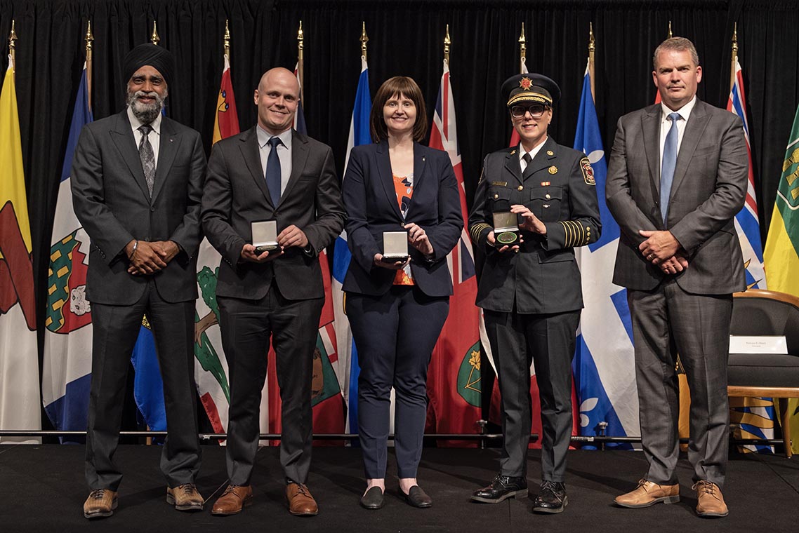 The Honourable Harjit S. Sajjan, President of the King's Privy Council for Canada and Minister of Emergency Preparedness (far left) and Minister responsible for the Pacific Economic Development Agency of Canada, and the Honourable Bloyce Thompson, Deputy Premier, Minister of Justice and Public Safety and Attorney General for Prince Edward Island (far right) are pictured with the 2022 award recipient of the Emergency Management Exemplary Service Award for the Resilient Communities category.