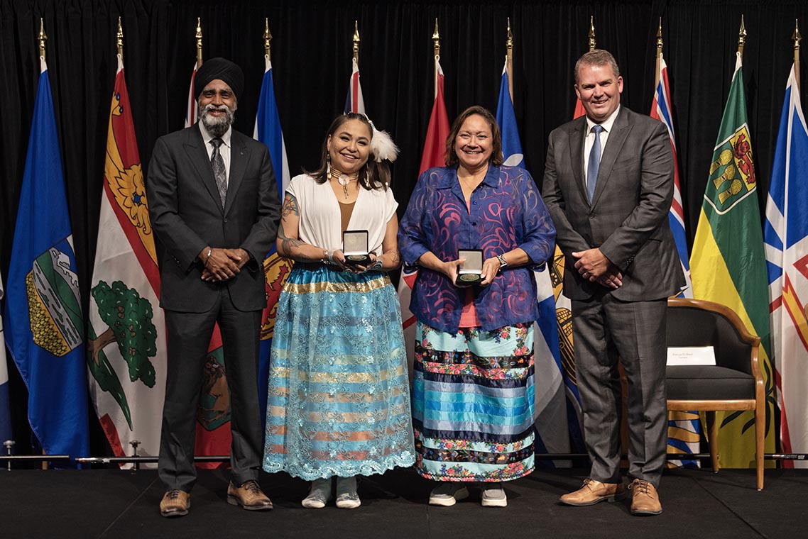 The Honourable Harjit S. Sajjan, President of the King's Privy Council for Canada and Minister of Emergency Preparedness (far left) and Minister responsible for the Pacific Economic Development Agency of Canada, and the Honourable Bloyce Thompson, Deputy Premier, Minister of Justice and Public Safety and Attorney General for Prince Edward Island (far right) are pictured with the 2022 award recipient of the Emergency Management Exemplary Service Award for the Resilient Communities category.