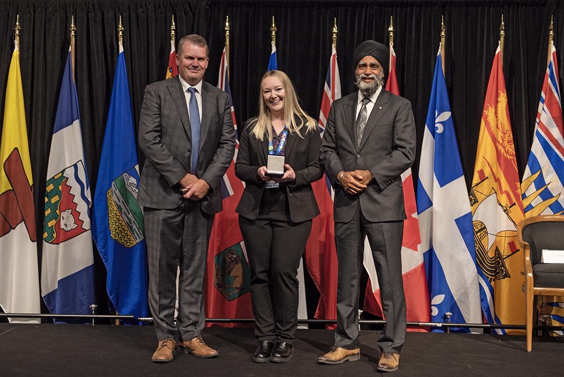 The Honourable Harjit S. Sajjan, President of the King's Privy Council for Canada and Minister of Emergency Preparedness (far left) and Minister responsible for the Pacific Economic Development Agency of Canada, and the Honourable Bloyce Thompson, Deputy Premier, Minister of Justice and Public Safety and Attorney General for Prince Edward Island (far right) are pictured with the 2022 award recipient of the Emergency Management Exemplary Service Award for the Youth category.